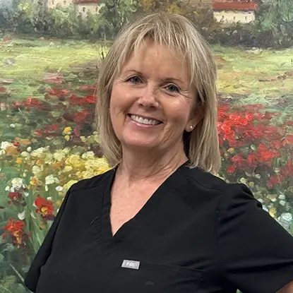 Lorrie, dental team member at Jacksonville dental practice, smiling professionally.